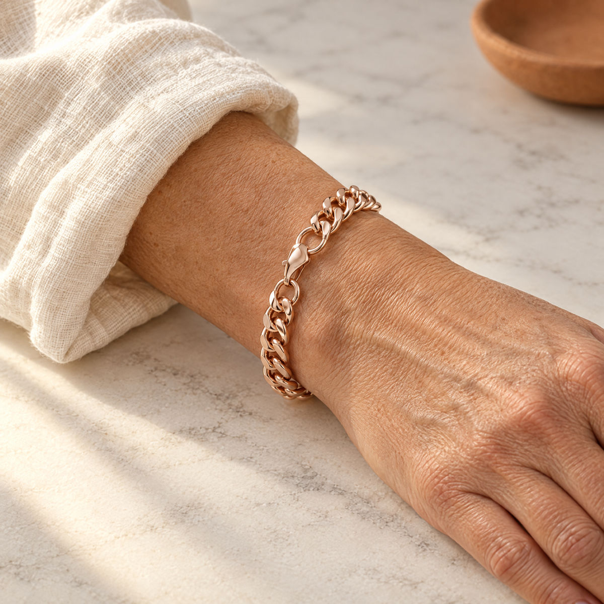 June's Cuffo Copper Bracelet – pure copper bracelet on a warm neutral background - photo 2