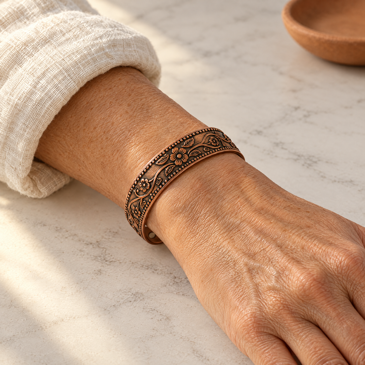 June's Knell Copper Bracelet – pure copper bracelet on a warm neutral background - photo 2